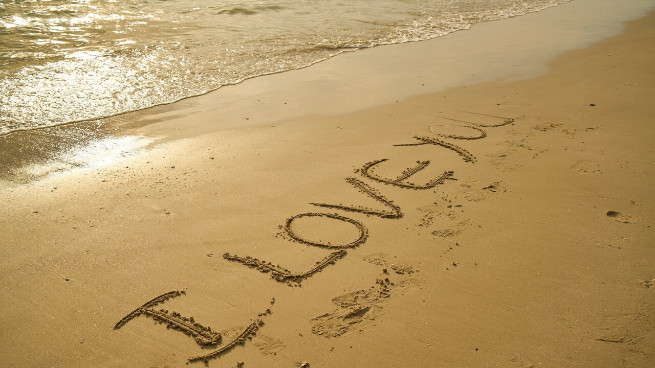 A Beach with the words I Love You written in the sand