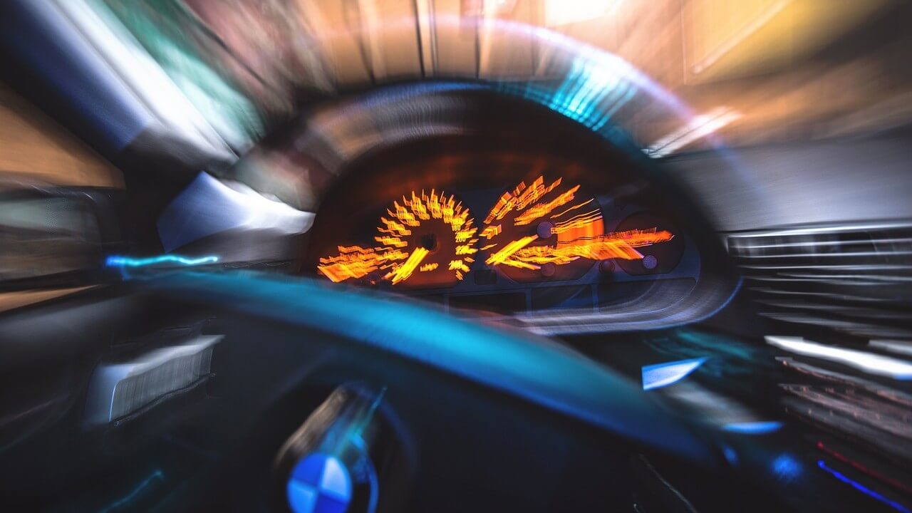 Car dashboard blurred out because it's moving so fast